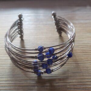 Cute silver tone multi strand open bracelet
